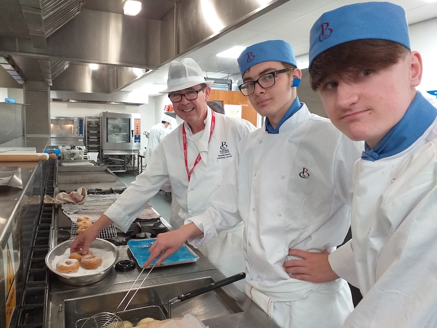 Photo of catering students in a kitchen