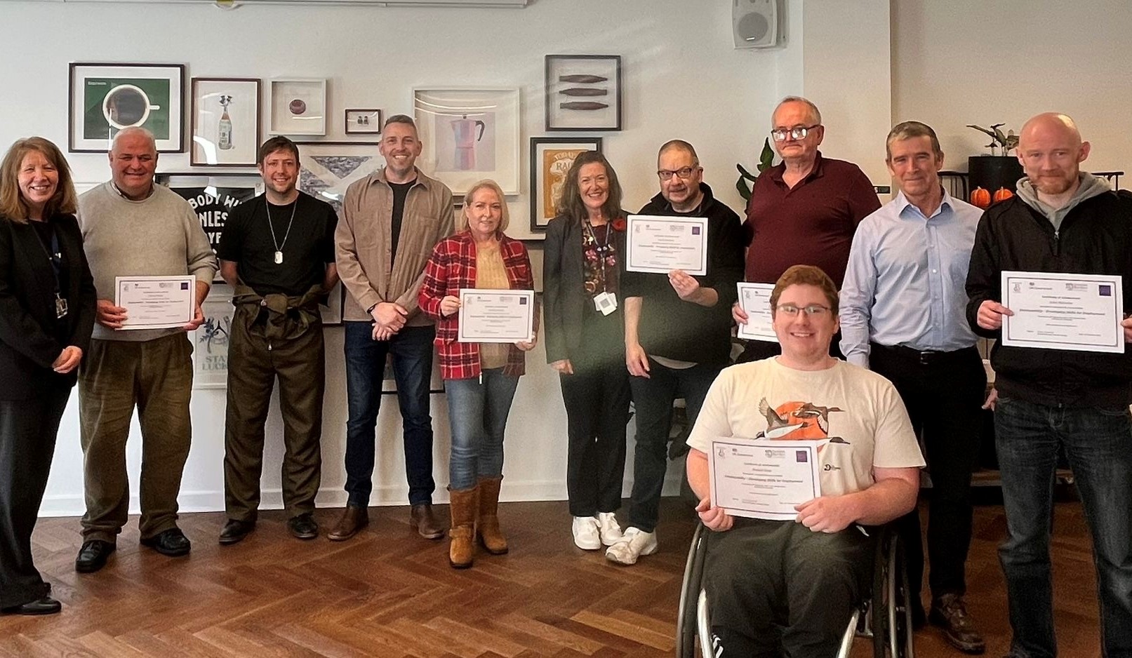 Group of candidates holding completion certificates