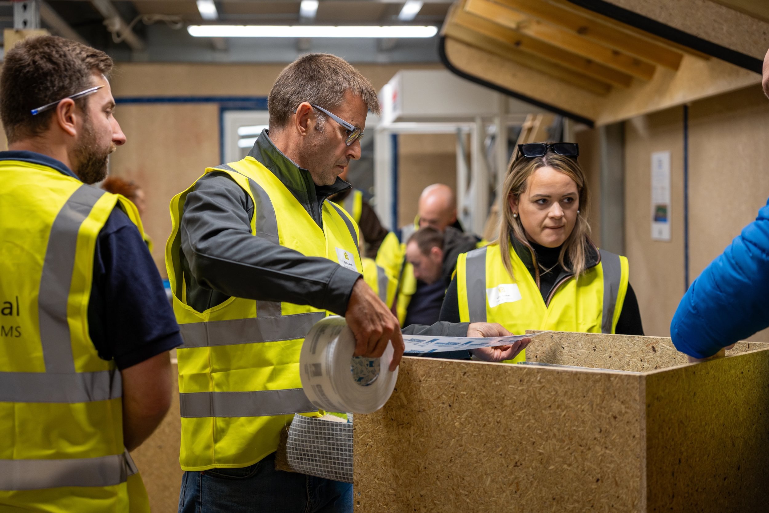 Group of people working in a workshop environment 